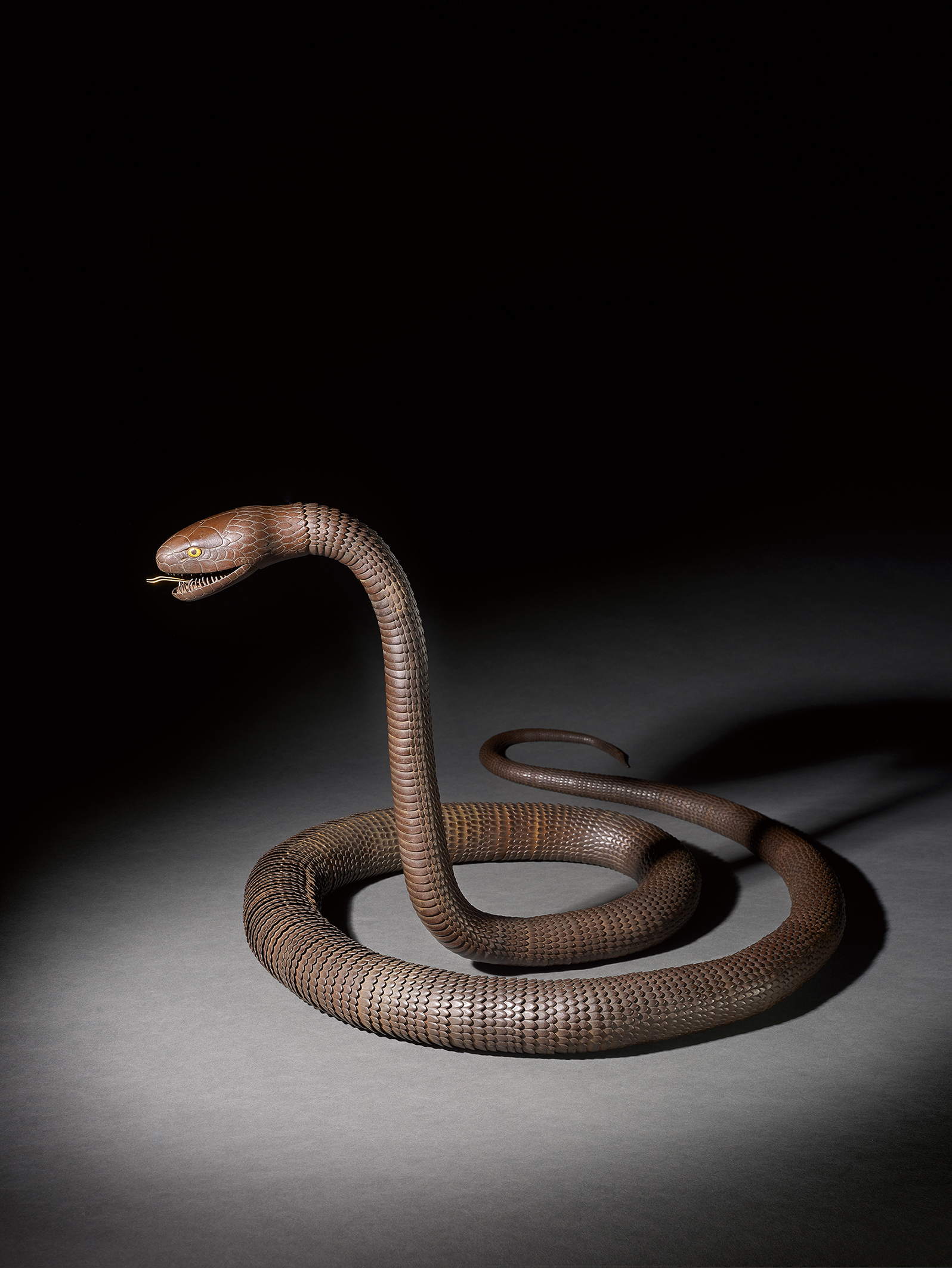 AN IRON ARTICULATED MODEL OF AN EXCEPTIONALLY LONG SNAKE WITH INSCRIPTION TENSHŌ NI-SEINEN MYOCHIN SONSHUN SAKU, EDO PERIOD, 19TH CENTURY, 303 cm., 119 1/2 in. long AN IRON ARTICULATED MODEL OF AN EXCEPTIONALLY LONG SNAKE WITH INSCRIPTION TENSHŌ NI-SEINEN MYOCHIN SONSHUN SAKU, EDO PERIOD, 19TH CENTURY, 303 cm., 119 1/2 in. long