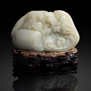 LYON & TURNBULL FINELY CARVED WHITE JADE 'RED CLIFF' BOULDER